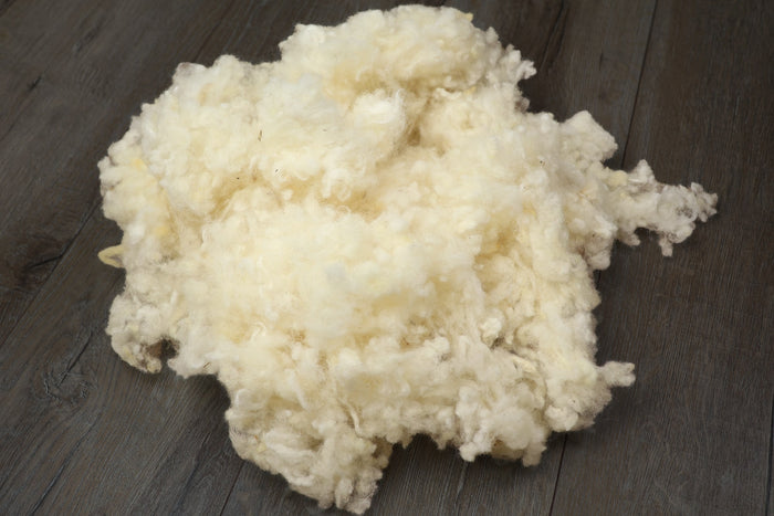 Kopfkissen-Füllung Wollflocken kbT aus eigener Herstellung, 1 kg – KLEINER Naturbettwaren